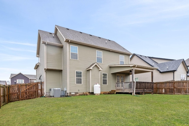 back of house with a yard, central air condition unit, and a deck