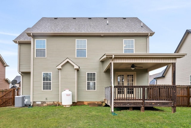 rear view of property with a wooden deck, ceiling fan, a lawn, and central air condition unit