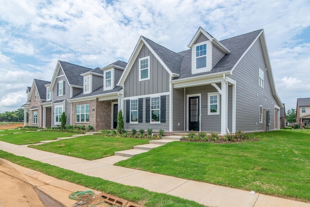 new england style home with a front lawn