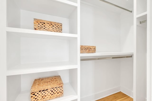 walk in closet featuring hardwood / wood-style flooring