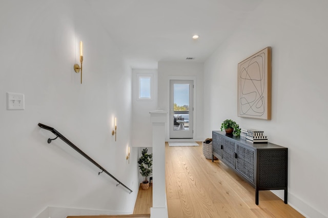 corridor featuring light hardwood / wood-style floors