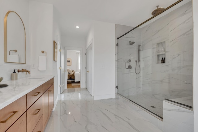 bathroom with vanity and a shower with shower door