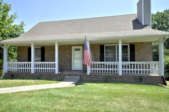 view of front facade with a porch and a front lawn