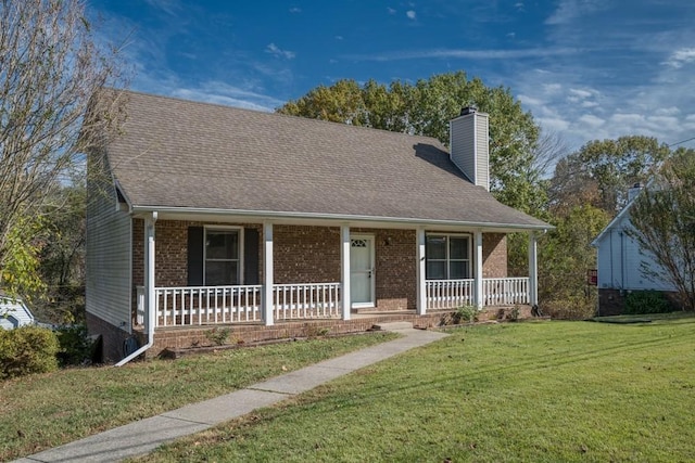 view of front of property with a front yard and a porch