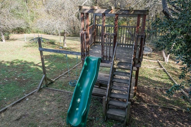 view of playground with a lawn