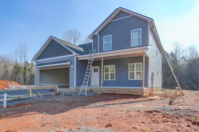 view of front of house featuring a garage and covered porch