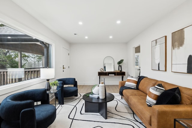 living room with light hardwood / wood-style floors and plenty of natural light