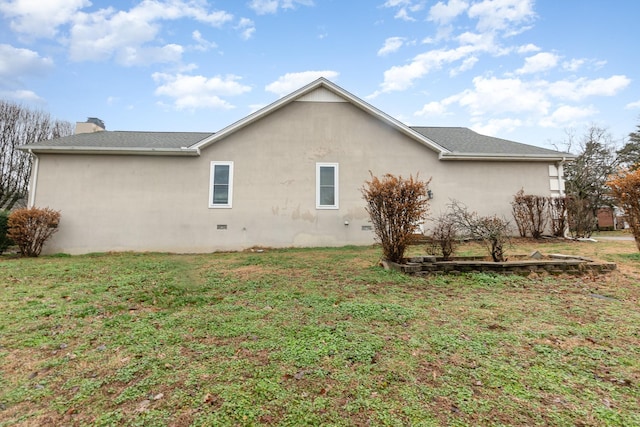 view of home's exterior featuring a yard