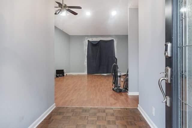 entrance foyer with dark parquet flooring and ceiling fan