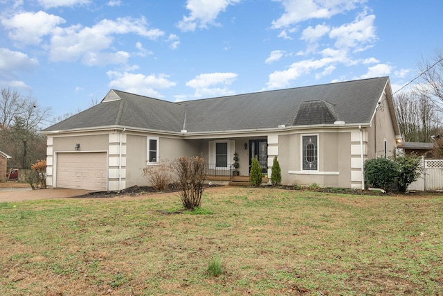 ranch-style house featuring a garage, a front lawn, and a porch