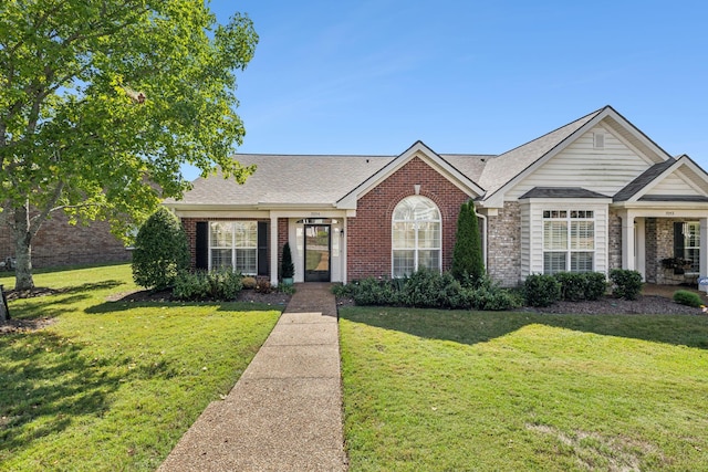 ranch-style home featuring a front lawn