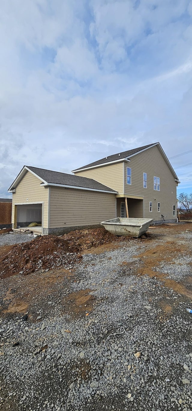 view of side of property with a garage