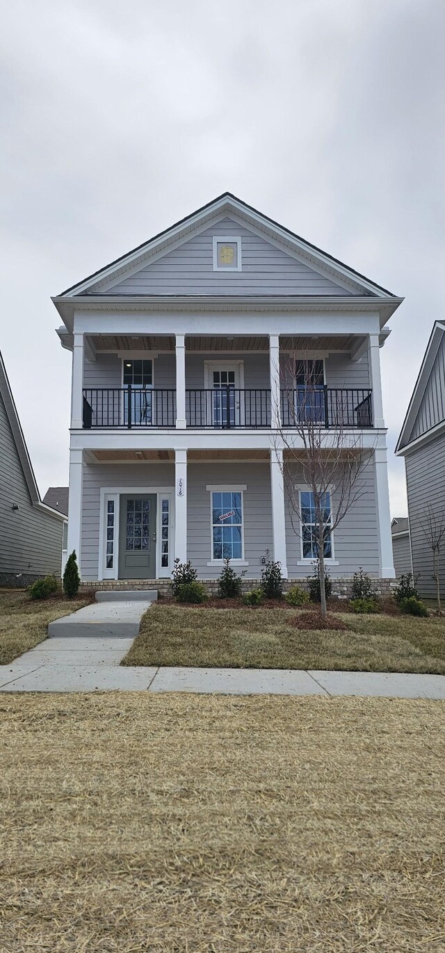 view of front of home with a balcony