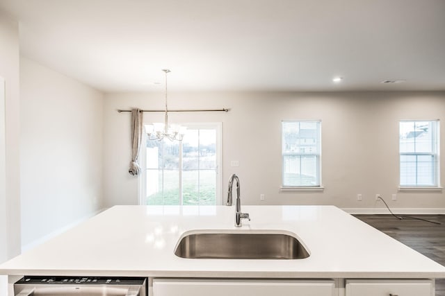 1335 Crescent Ridge Dr, Gallatin, TN 37066 - kitchen with white cabinetry, sink, a kitchen island with sink, and pendant lighting