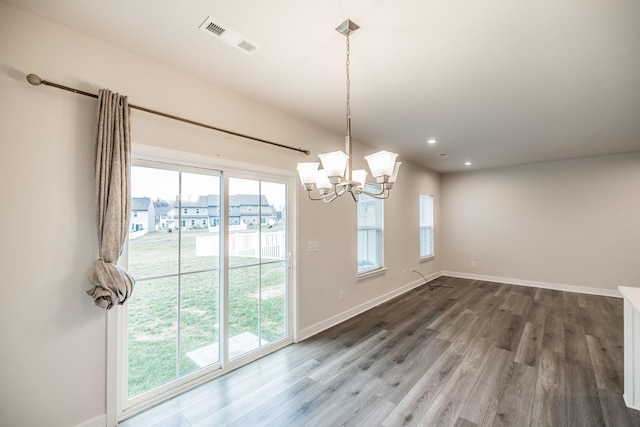 1335 Crescent Ridge Dr, Gallatin, TN 37066 - unfurnished dining area with an inviting chandelier, a wealth of natural light, and wood-type flooring