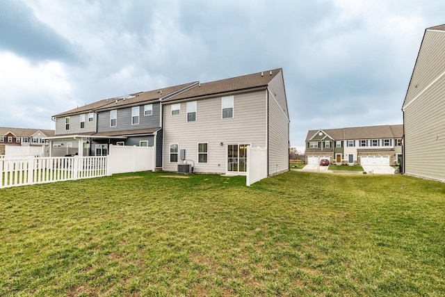 1335 Crescent Ridge Dr, Gallatin, TN 37066 - back of property with a yard and central AC unit
