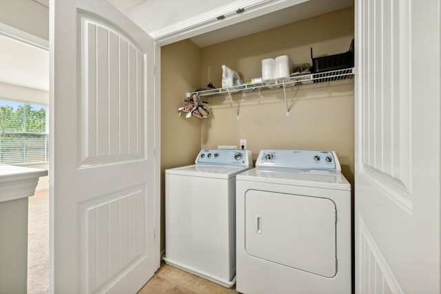 laundry area featuring washing machine and clothes dryer