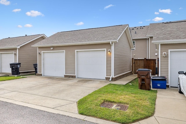 view of home's exterior featuring an outbuilding and a garage