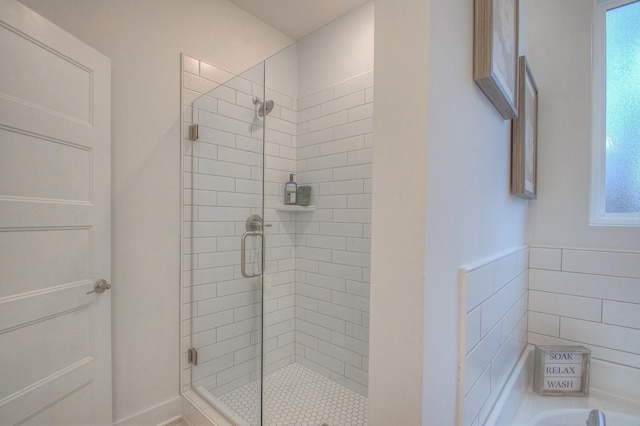 bathroom with a shower with shower door