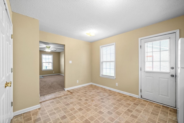 entryway featuring a textured ceiling