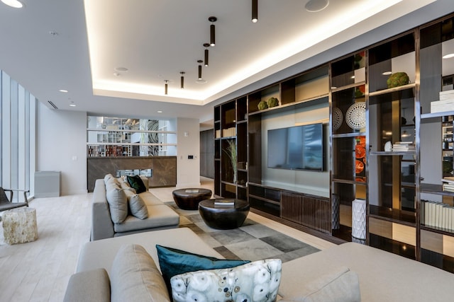 515 Church St Unit 3208, Nashville, TN 37219 - living room with a tray ceiling and hardwood / wood-style flooring