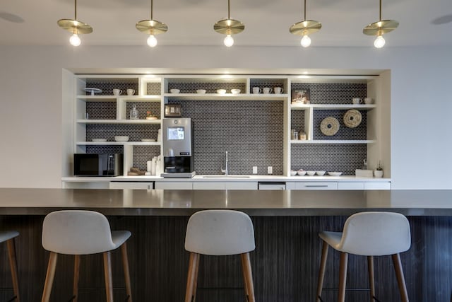 515 Church St Unit 3208, Nashville, TN 37219 - bar with pendant lighting, sink, and built in features