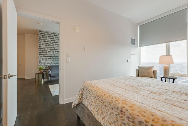 515 Church St Unit 3208, Nashville, TN 37219 - bedroom with a fireplace and dark wood-type flooring