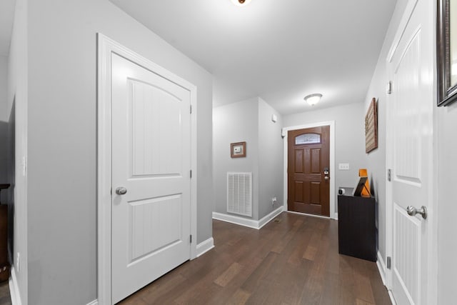 foyer with dark wood-type flooring