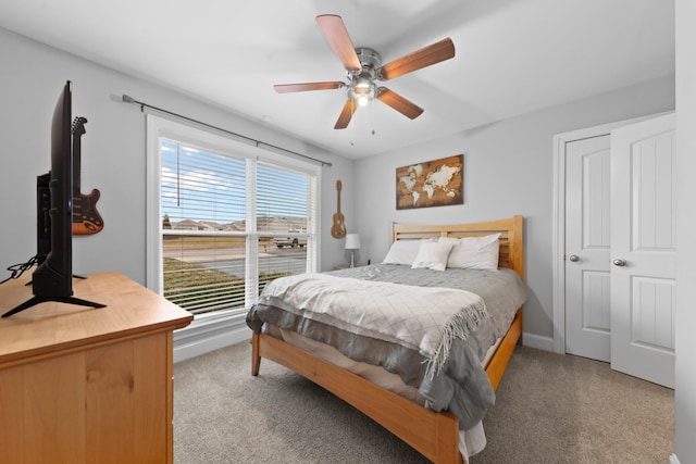 carpeted bedroom featuring ceiling fan