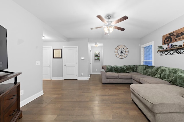 living room featuring dark hardwood / wood-style floors and ceiling fan