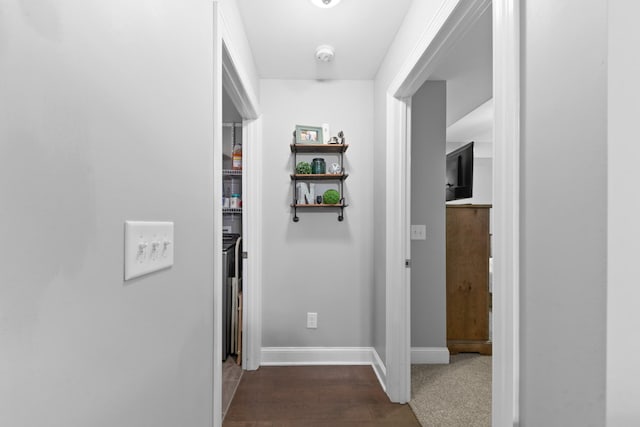 hallway with dark wood-type flooring