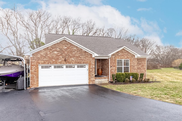 view of front of property with a garage, a carport, and a front yard