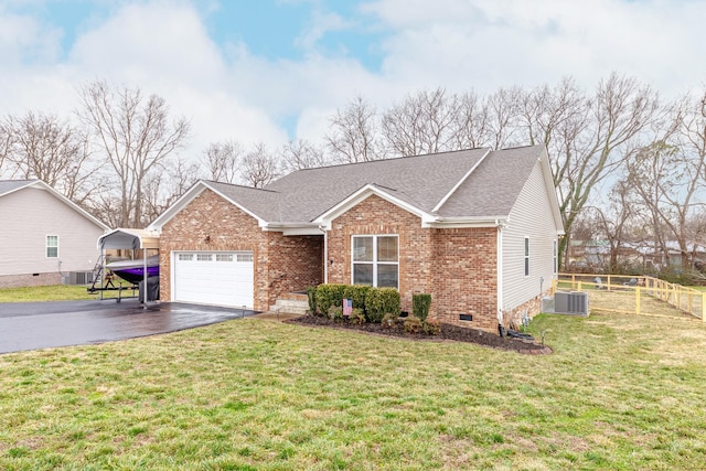 single story home with a garage, a front lawn, a carport, and central air condition unit