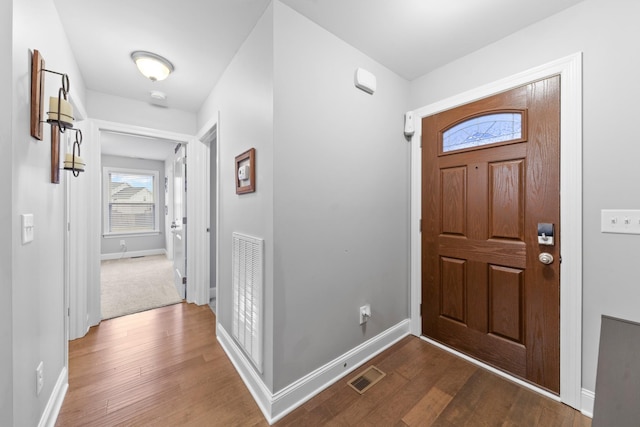 entryway with hardwood / wood-style floors