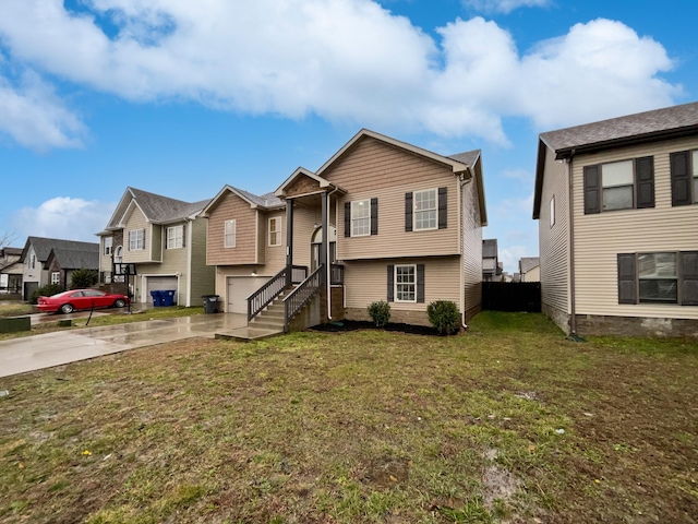 view of front of home with a garage and a front yard