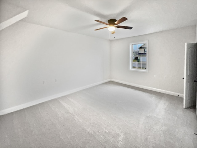 unfurnished room with carpet and ceiling fan