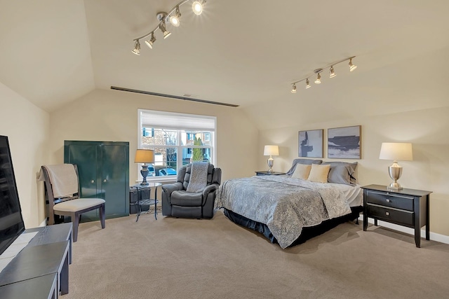 bedroom featuring lofted ceiling and carpet floors