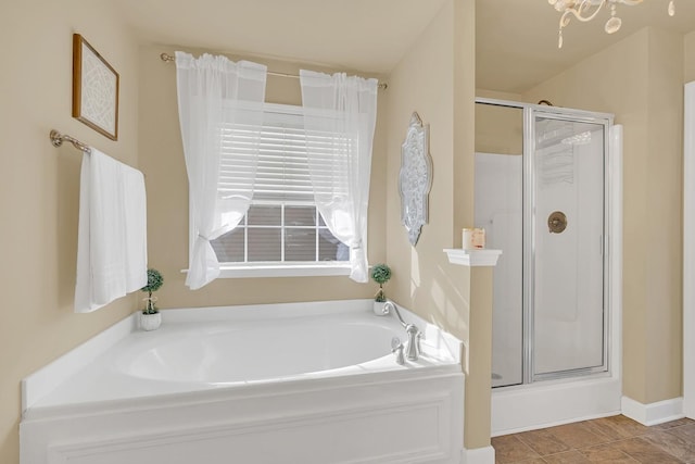 bathroom featuring tile patterned flooring and plus walk in shower