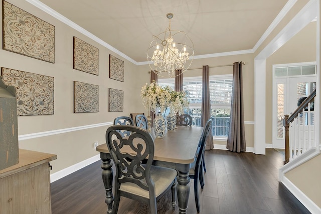 dining room featuring ornamental molding, dark hardwood / wood-style floors, and a chandelier