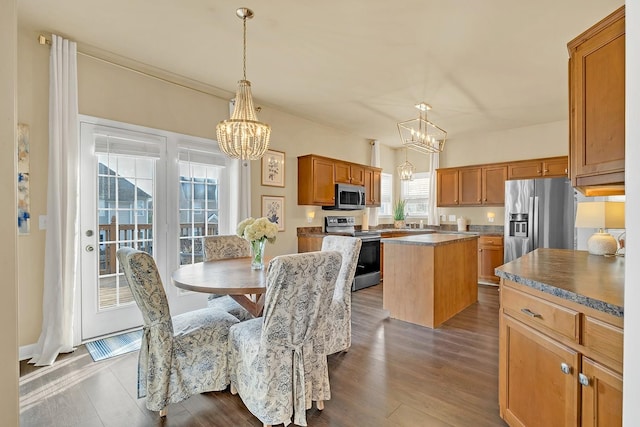 dining area with a chandelier and hardwood / wood-style floors