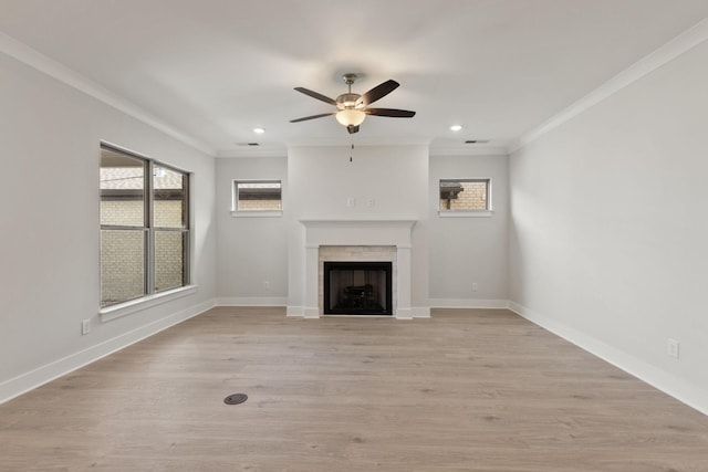 unfurnished living room with crown molding, ceiling fan, and light hardwood / wood-style flooring