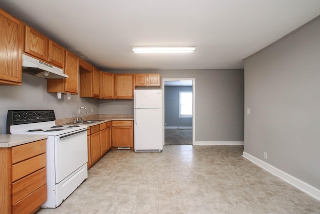 kitchen featuring white appliances, baseboards, light countertops, under cabinet range hood, and a sink