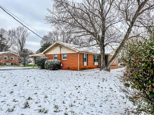 exterior space with crawl space and brick siding