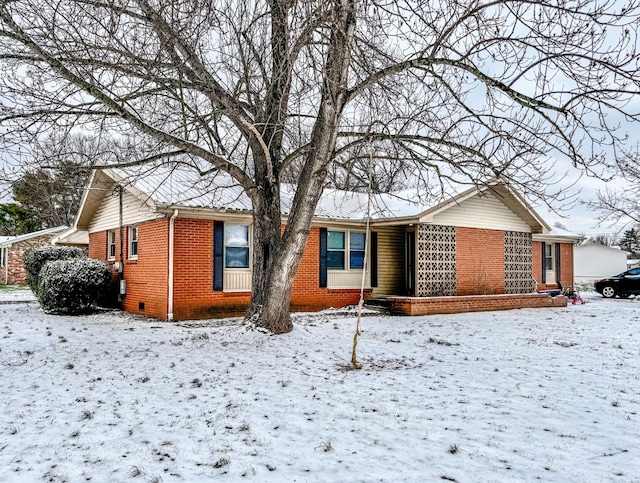 view of front of home featuring brick siding