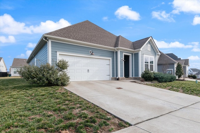 view of front of house with a garage and a front yard