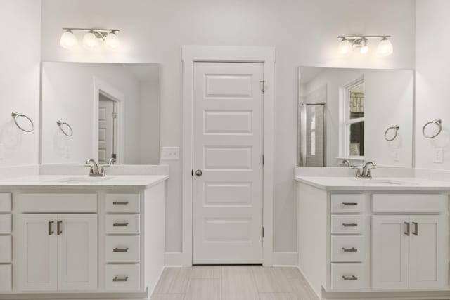 bathroom featuring walk in shower and vanity