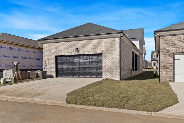 view of side of property with cooling unit and a yard