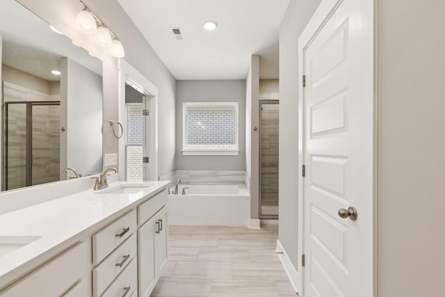 bathroom with plus walk in shower and vanity