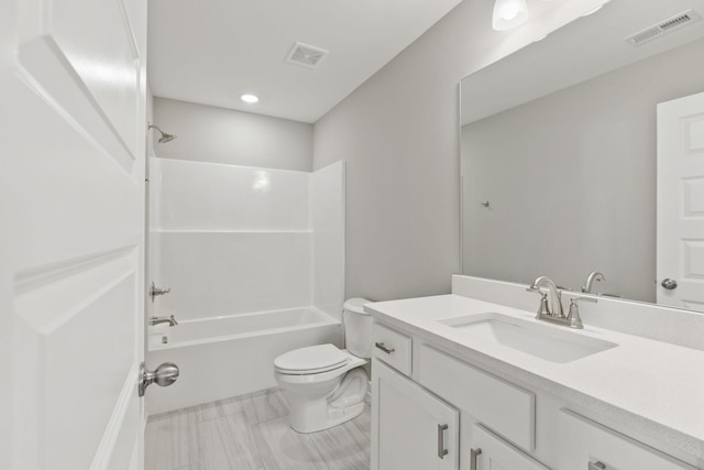 full bathroom featuring shower / bath combination, vanity, and toilet