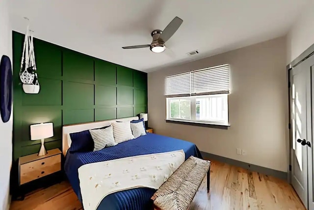 bedroom featuring ceiling fan and light wood-type flooring